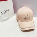 Close-up of pink baseball cap featuring rhinestone crown and shimmering crystal brim detail - Adult, Adjustable / Pink