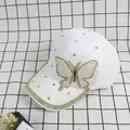 Detail of white baseball cap with pearl and rhinestone butterfly embellishments - Adult Size (Adjustable) / White