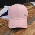 Detail of pink canvas baseball cap with rhinestone sunburst and silver M metal buckle - M (56-58cm) / M Logo / Pink