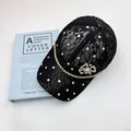 Elegant black lace baseball cap with sparkling rhinestones and a gold bow fastener - Black