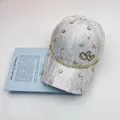 Light gray lace baseball cap with sparkling rhinestones and metal double heart logo detail - Adult (Adjustable) / Silver White