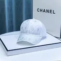 Detailed view of white rhinestone baseball cap with sparkling crystal patterns and letter motifs - Adult / White