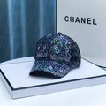 Sparkling black rhinestone baseball cap with holographic floral print on a display stand - Adult / Black