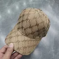 Detail of khaki sun hat with sparkling rhinestone letter pattern and twill texture - Adult, Adjustable / Khaki (M Letter)