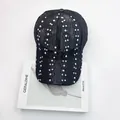 Elegant black lace baseball cap with shimmering rhinestones on a white magazine background - Adult Size (Adjustable) / Black