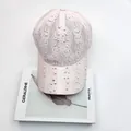 Close-up of pink lace baseball cap with sparkling iridescent rhinestones and fine texture - Adult Size (Adjustable) / Pink
