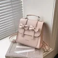 Zaino in pelle PU rosa con fiocchi decorativi e manico superiore per trasporto versatile - Senza Ciondolo / Rosa