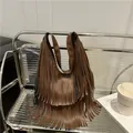 Chic brown PU leather hobo bag with long tassels and double handles in a retro style - Brown