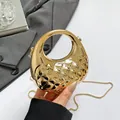 Chic gold metallic quilted box bag with circular handle and chain shoulder strap - Yellow