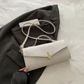 Sac bandoulière blanc ivoire à texture crocodile avec fermoir note de musique dorée - Blanc