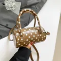 Brown polka dot cylinder pillow bag with adjustable strap and twin top handles - Brown