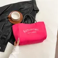 Vibrant rose pink nylon tote bag with white lettering and black knot handles - Rose Red
