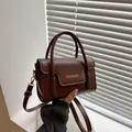 Chic dark brown faux leather mini square handbag with top handles and gold-tone hardware - Coffee