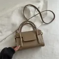 Fashionable dark khaki crossbody square bag with gold FASHION text and dual handles - Camel