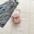 Chic pink quilted mini crossbody phone bag with silver bow accent and chain strap - Pink
