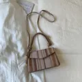 Mini woven crossbody bag with striped pattern and adjustable strap in earth tones - Khaki