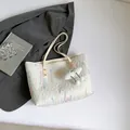 Large white quilted shoulder tote bag with colorful wave embroidery and cloud charm - White With Pendant