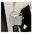Silver sequin crossbody bag for women with golden V buckle and long shoulder strap - Silver