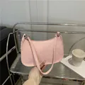 Pink faux snakeskin underarm bag for women with elegant textured surface and metal zipper - Pink