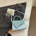 Light blue crossbody bag in tweed and leather mix with gold metal accents - Blue