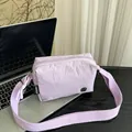 Chic light purple pleated nylon square crossbody bag with woven strap on laptop - Purple