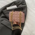 Pink quilted chain crossbody bag with gold metallic straps and rhombus pattern - Pink