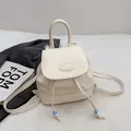 Minimalist beige faux leather backpack with PAUTOR logo and blue bead drawstring - White