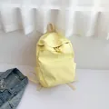 Mochila plegable ligera amarillo claro con detalles de cordón y bolsillos laterales - Amarillo