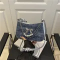 Fashionable denim underarm bag with silver bow and pearl chain detail for 2025 summer - Dark Blue