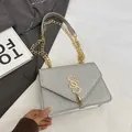 Glitzernde silberne Pailletten-Umhängetasche mit goldener Quaste und Kettenriemen - Silber