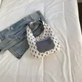 Canvas floral tote with black bow patterns and gingham front pocket detail - Black