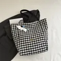Retro black and white checkered canvas tote bag with a plush dog charm and metal tag - Black With Pendant