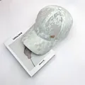 Lace baseball cap in mint green with metal M logo and floral embroidery patterns - Adult Adjustable / Light Green