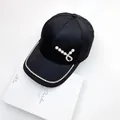 Detail of black jacquard baseball cap with rhinestone brim and pearl heart buckle decoration - Adult Size, 58cm Adjustable Circumference / Black