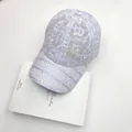 Detail of lavender lace baseball cap with sparkling rhinestones and a 3D butterfly patch - One Size / Light Purple