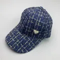 Detail of tweed baseball cap with gold grid lines and pearl heart ornament - Adult Size (Adjustable) / Navy Blue