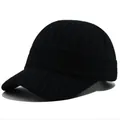 Detail shot of the black knitted baseball cap showing the warm textured ribbed wool material - Adult, Adjustable / Black