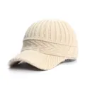 Close-up of cream knitted baseball cap showing vertical ribbed texture and peak - Adult, Adjustable / Off White