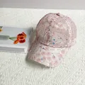 Detail of light pink mesh baseball cap featuring 3D plum blossom sequins and floral texture - Adult Size (Adjustable) / Pink