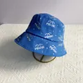 Detail of blue bucket hat featuring rhinestone PRANK lettering and palm tree design - M (56-58cm) / Blue with White Zirconia