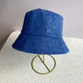 Detail of royal blue bucket hat with sparkling rhinestone N pattern and wide brim - M (56-58cm) / Blue