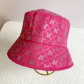 Detail of hot-fix rhinestones forming letter N pattern on hot pink fisherman hat - M (56-58cm) / Rose Red