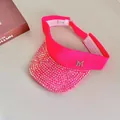 Detail of neon pink visor with rhinestones, M-logo emblem and adjustable velcro strap - Rose Red