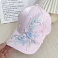 Pink satin baseball cap with floral embroidery and pearl accents shown from a side view - Adult Size (Adjustable) / Pink Floral Lace
