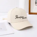 Close-up of cream canvas baseball cap featuring Per aspera ad astra black embroidery - Adult Size (Adjustable) / Beige