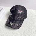 Close-up of black lace baseball cap with iridescent rhinestone butterfly and Love script - Adult Size (Adjustable) / Black