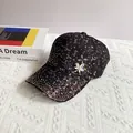 Close-up of black lace baseball cap with sparkling rhinestones and crystal leaf brooch - Adult Size (Adjustable) / Black