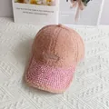 Detail of pink fleece baseball cap featuring rhinestone brim and Take Off embroidery - Adult Size (Adjustable) / Pink