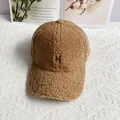 Detailed close-up of brown sherpa fleece baseball cap with embroidered H letter - Adult Adjustable / Khaki