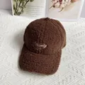 Detail of embroidered letters on deep brown lambswool baseball cap for winter season - Adult Size (Adjustable) / Coffee